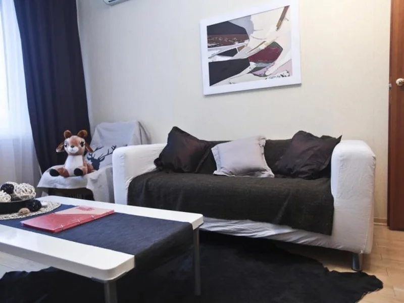 Гостиная зона в апартаментах Design Suites Noviy Arbat